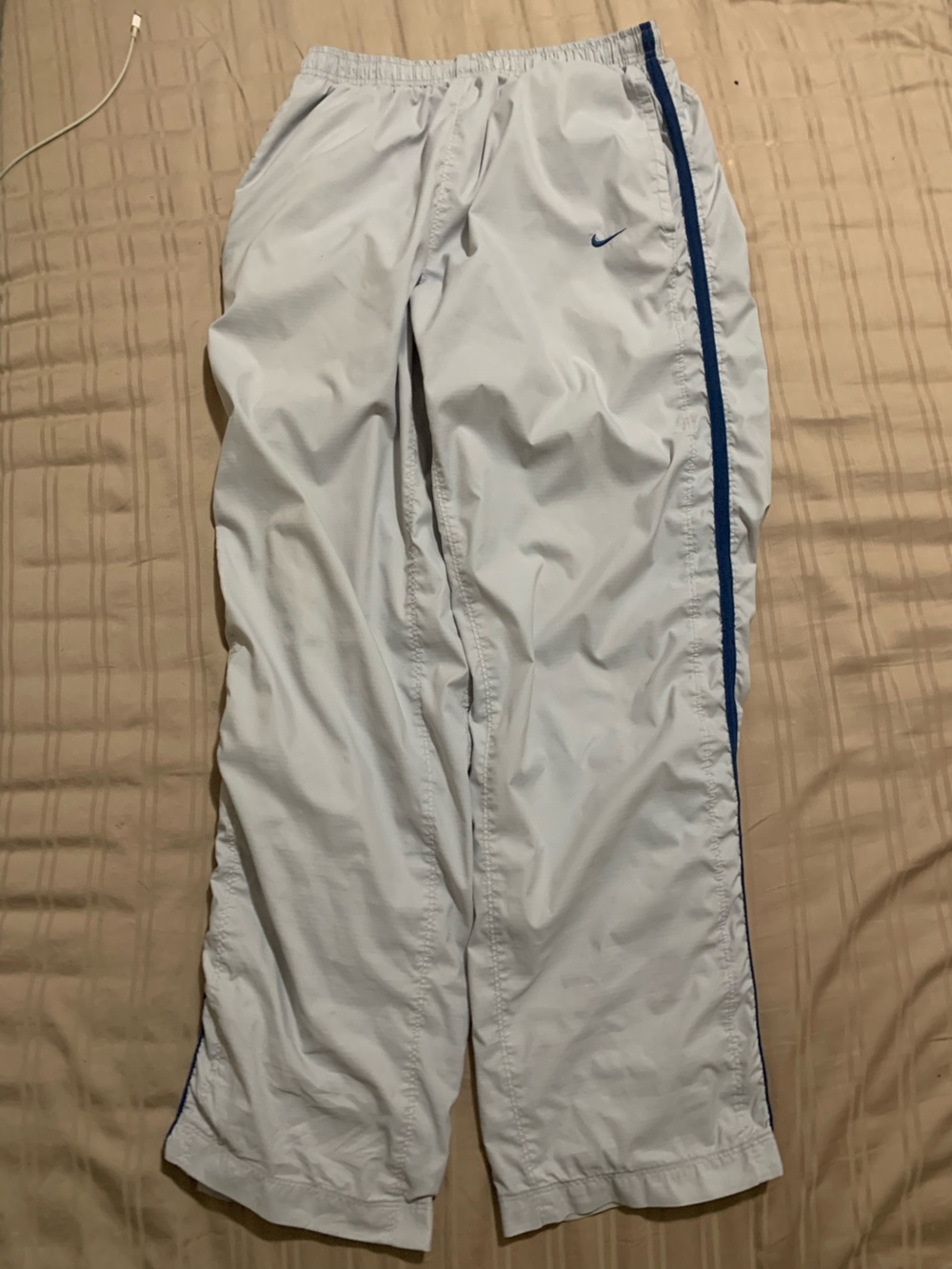 Vintage Nike White track pants with Blue Trim and Silver Logo y2k 2000s